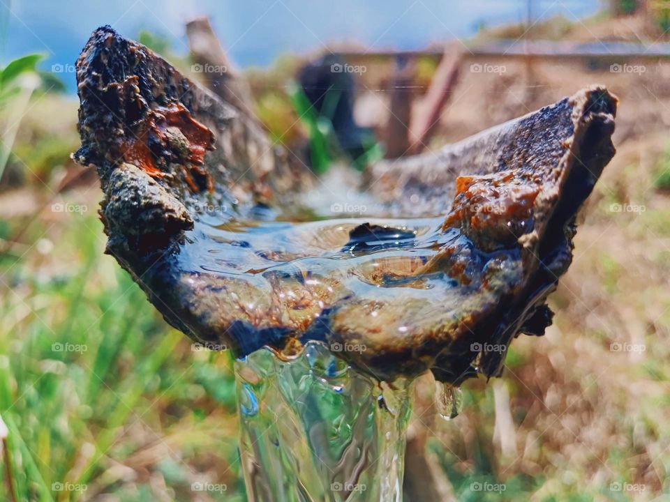 water running on bamboo