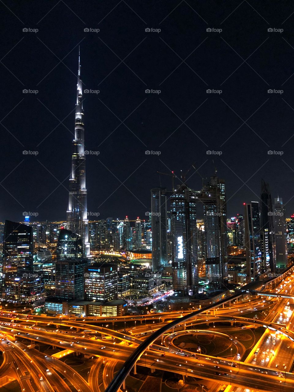 A view of downtown Dubai at night! The iconic Burj Khalifa towers over the city! 
