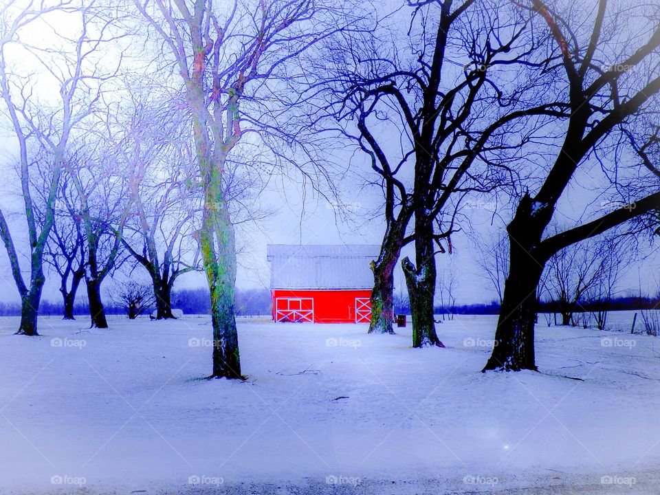 Beautiful red barn in the snow