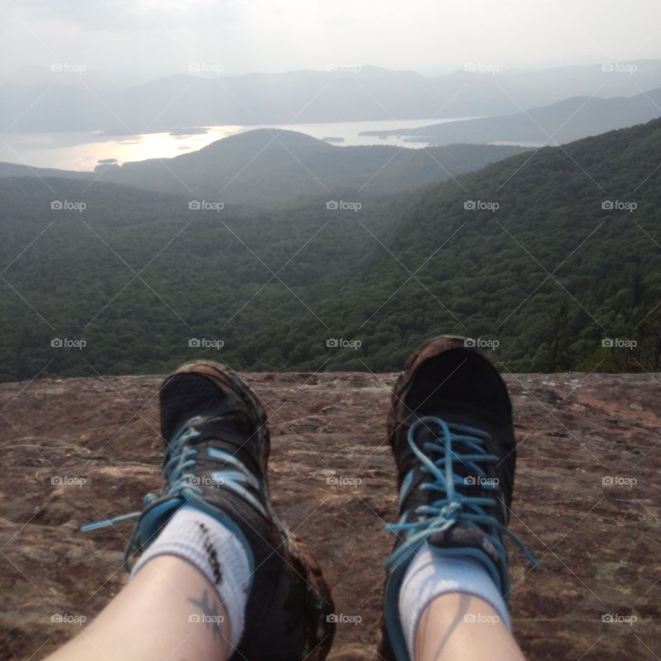 earn the view. these muddy feet hiked miles see Lake George from this angle