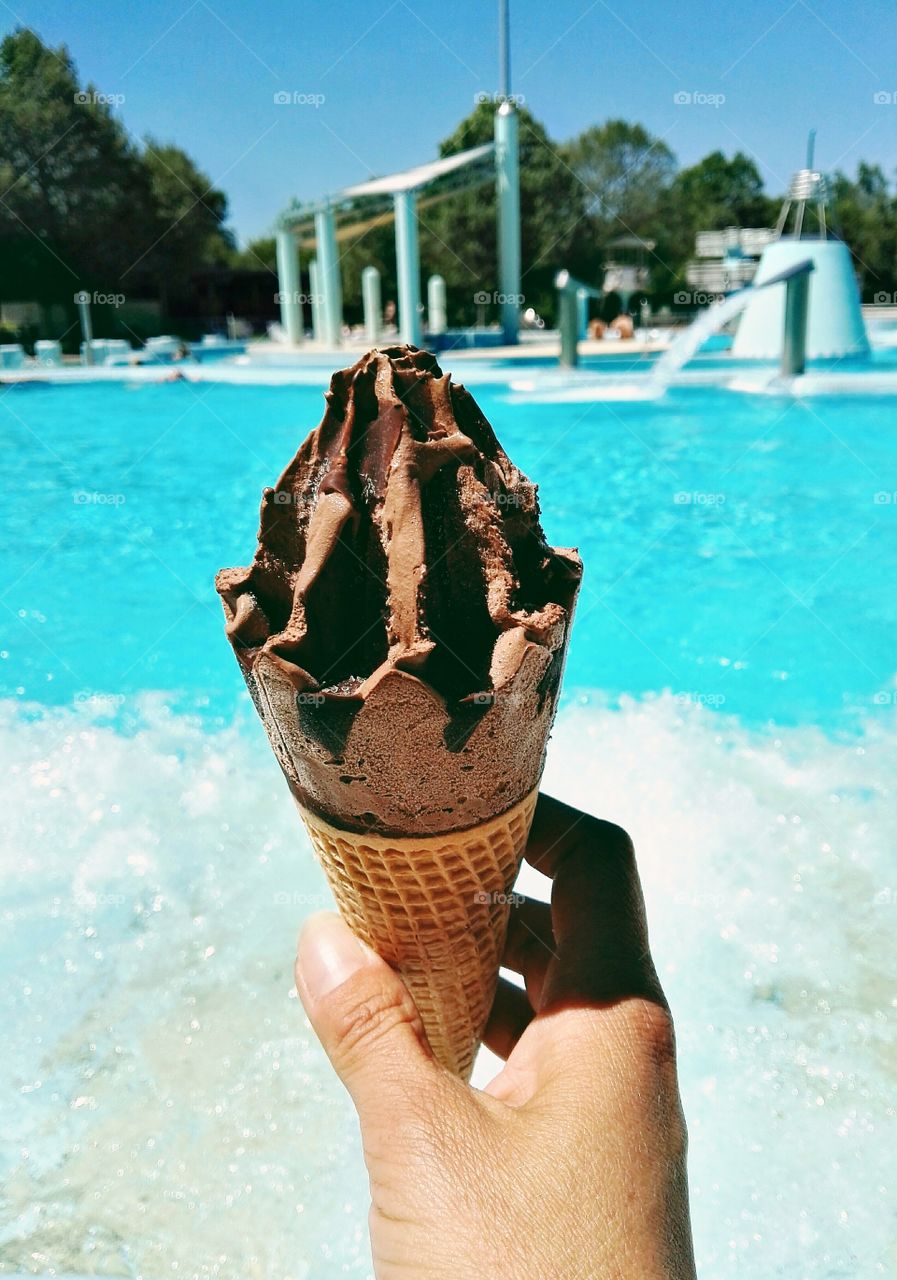 Person holding ice cream cone