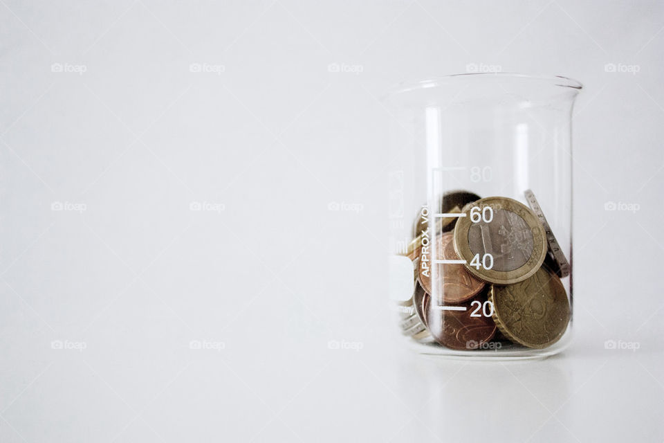 Coins in beaker