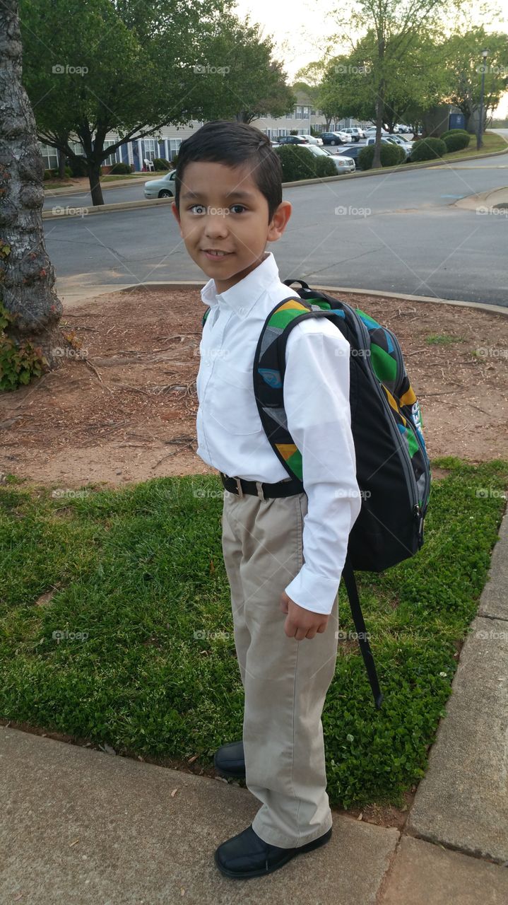 Portrait of a schoolboy with his backpack