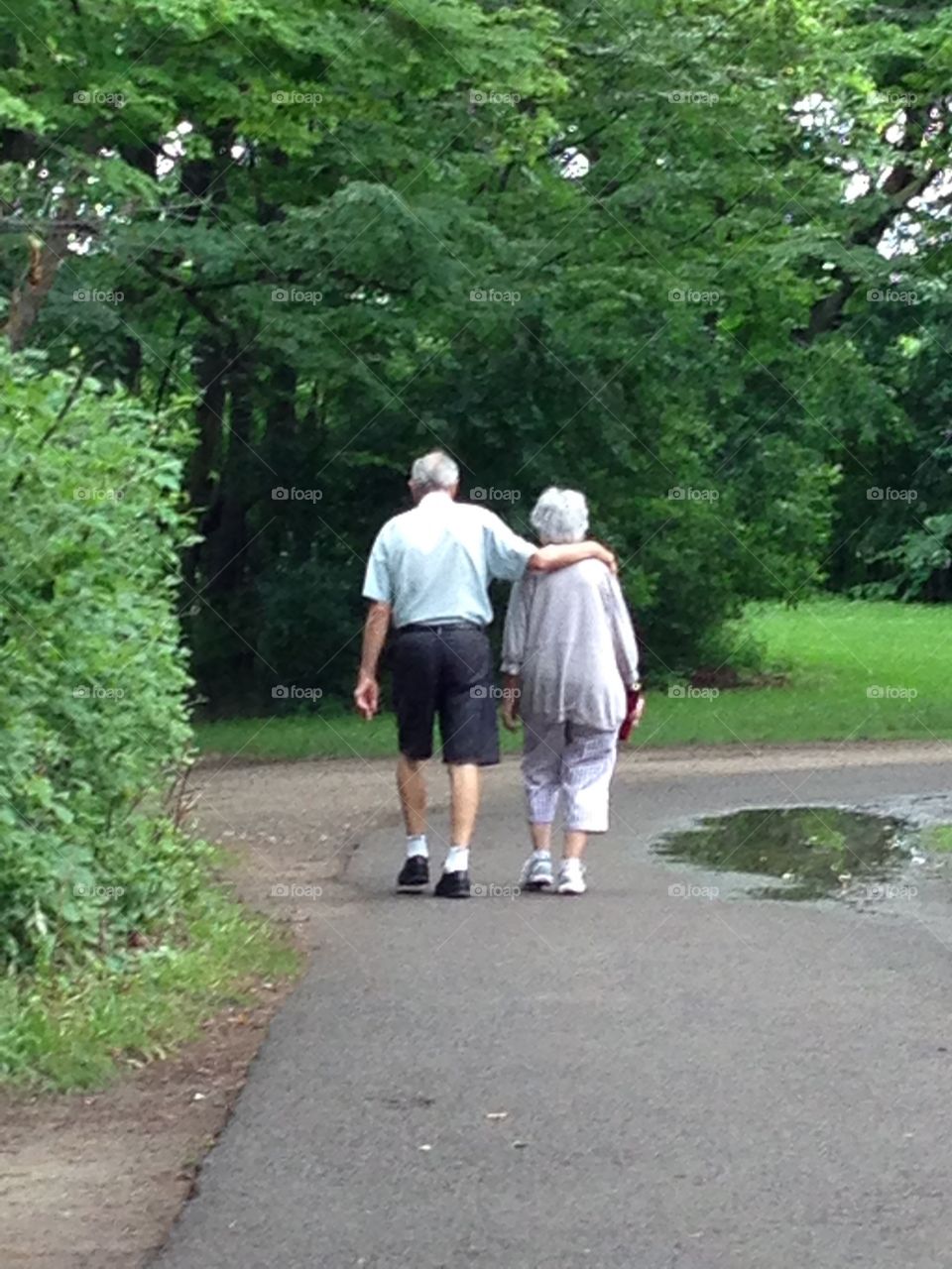 Old couple being a shoulder for each other 