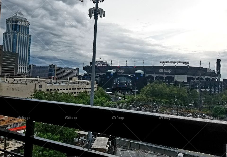 Carolina Panthers view to Bank of America stadium across the tracks from Circa Apartments on cloudy day.