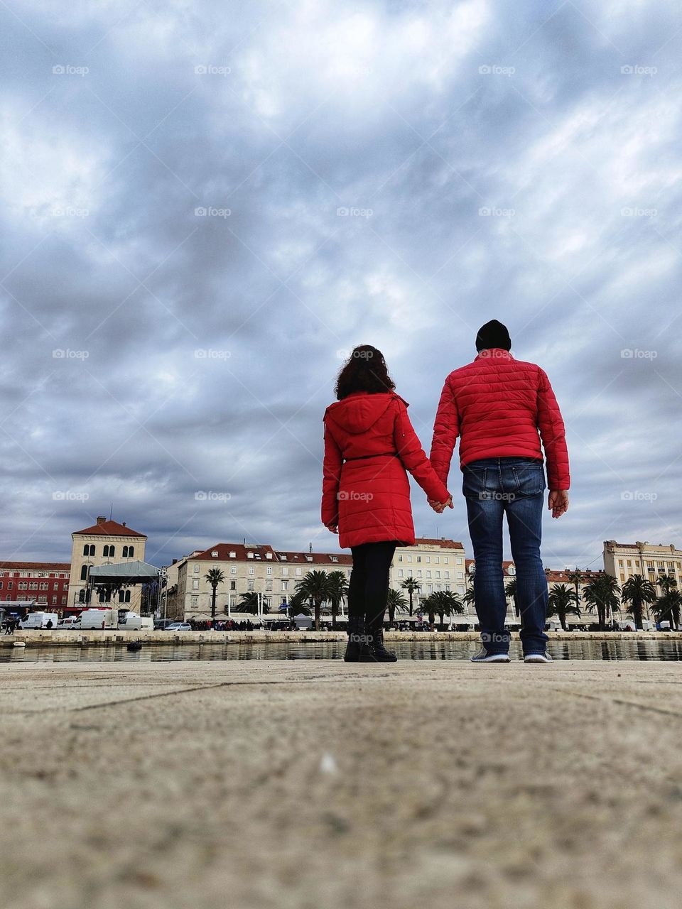 couple in love and embrace look at the waterfront of Split in Croatia
