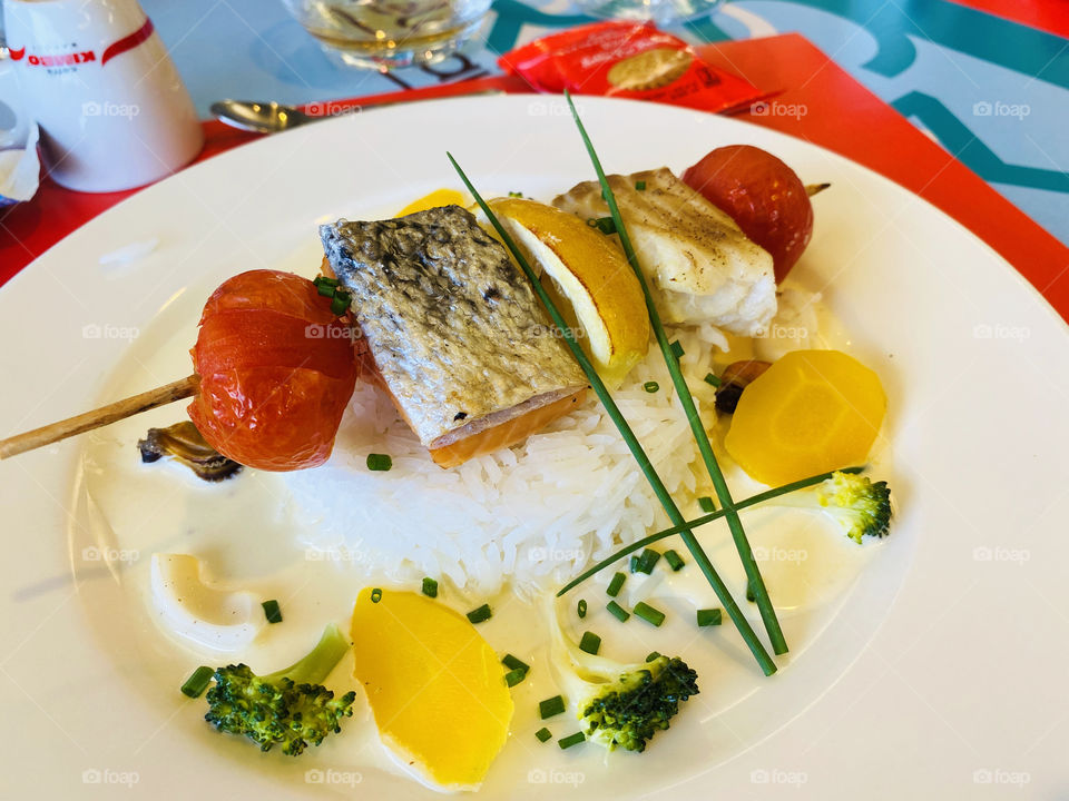 Parisian cuisine with fish and vegetables 