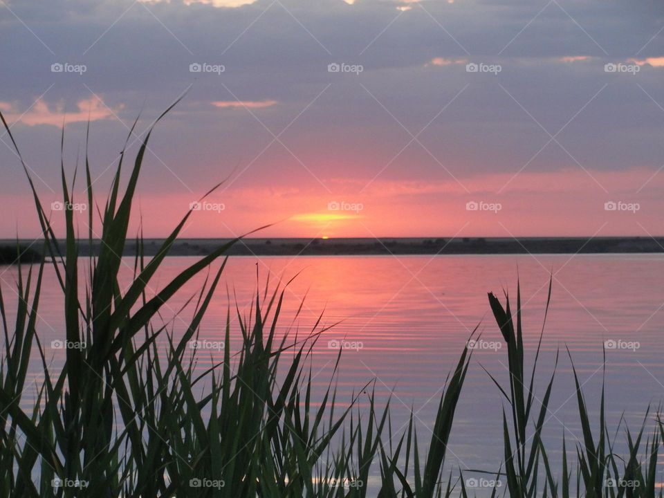 Pink sunset over the lake