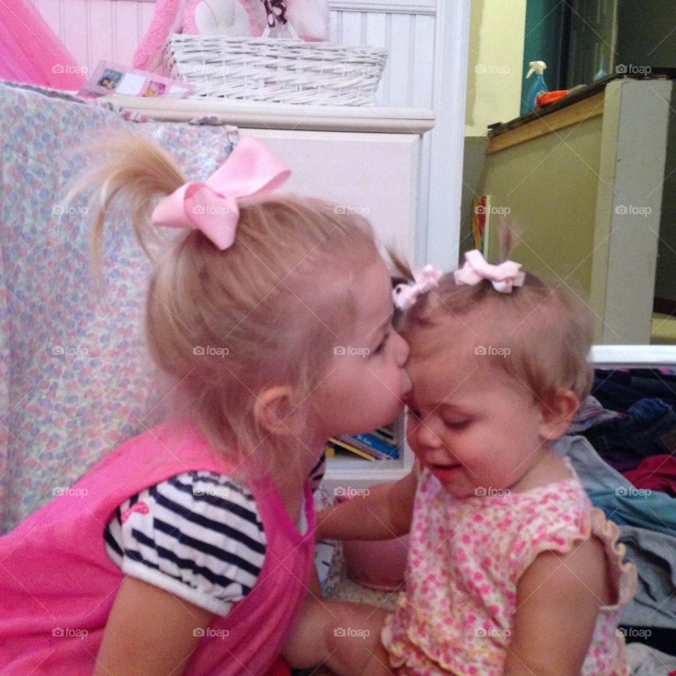 Kisses . Sister love