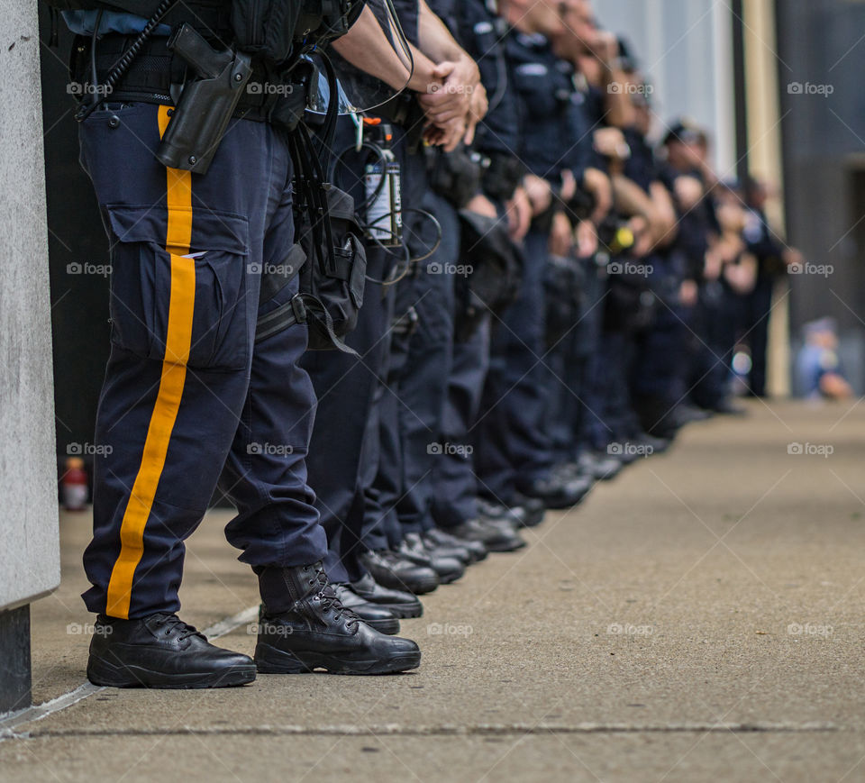 guard in a row on street