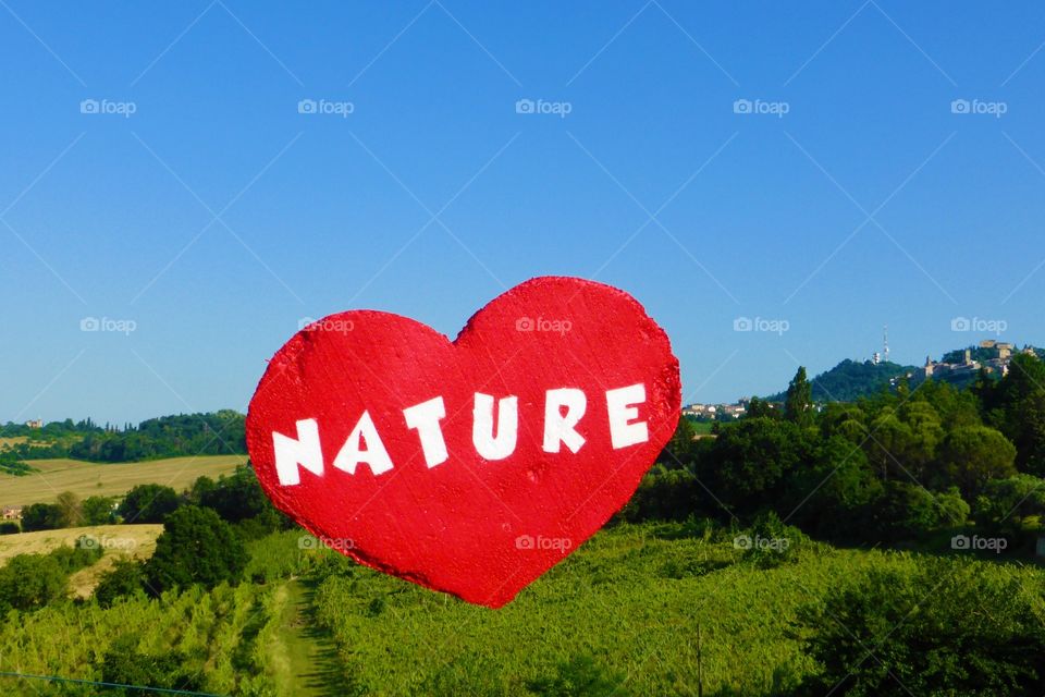 Heart's nature kick in the air. Heart's nature is flying in the blue Sky