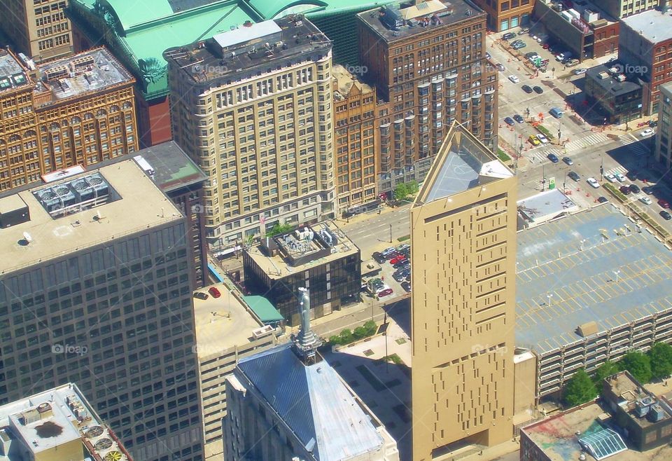 Looking down on Chicago, IL. The building that you see with the triangle roof, is a prison. You can see the basketball court from this picture. 