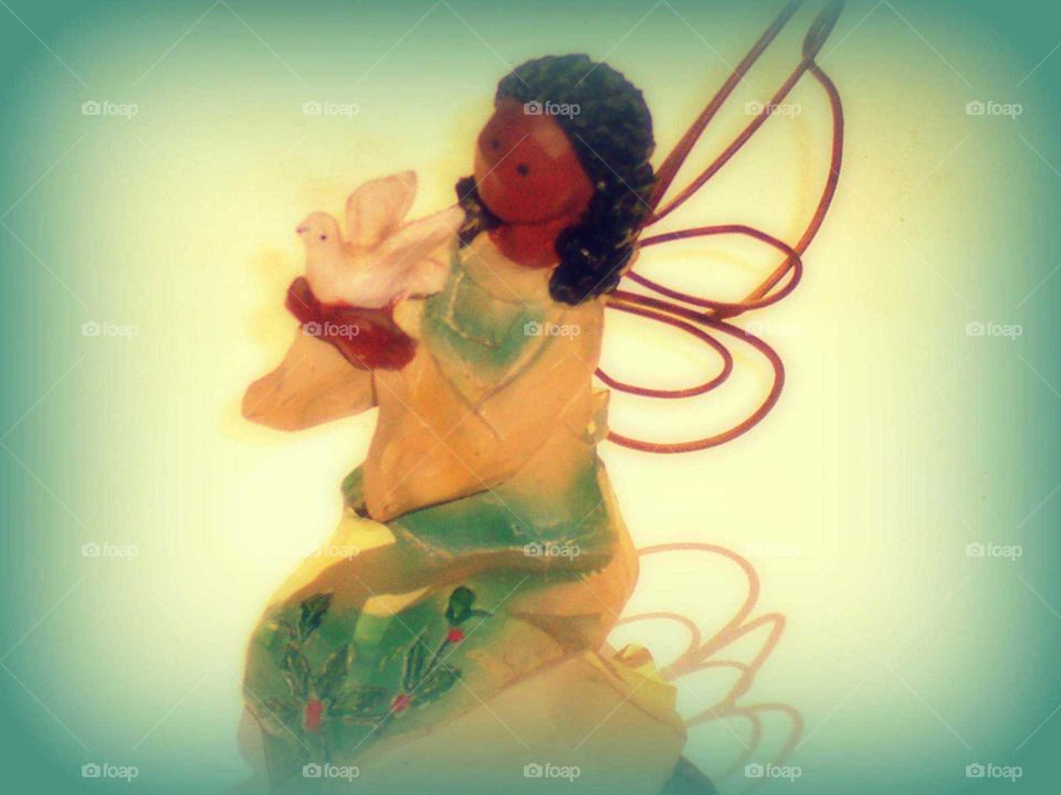 African American Angel figurine holding dove
