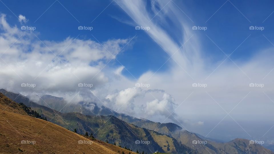 Almaty mountain peaks and clouds