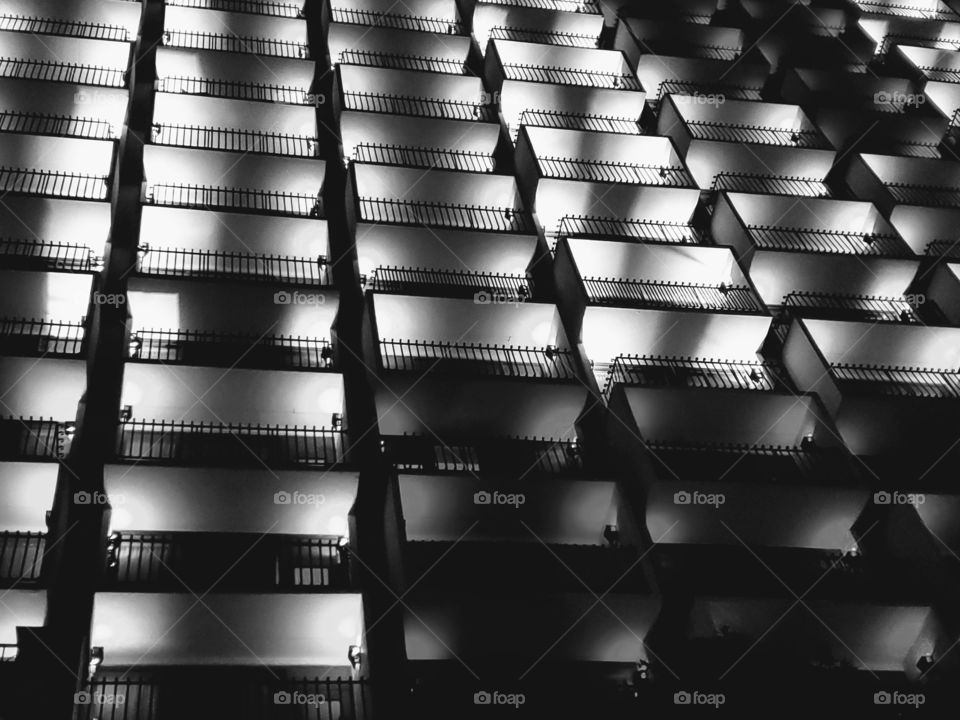 Black and white photo:  view of hotel balconies