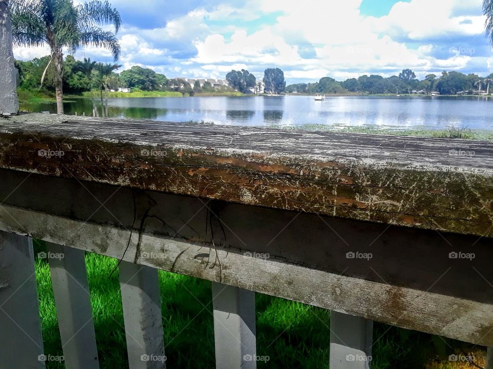 beautiful lake and old wooden railing