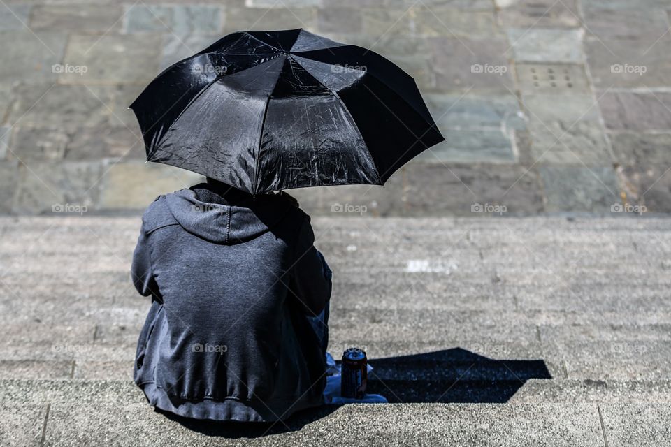 Man with black umbrella 