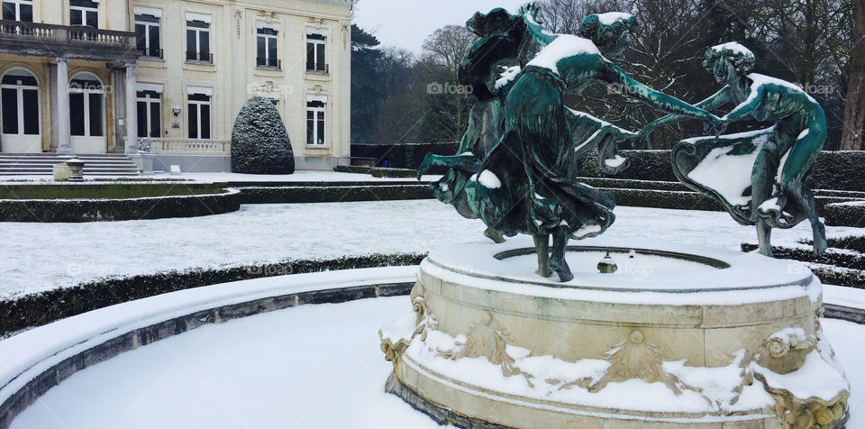 Castle and sculpture in park “Den Brandt” in Antwerp, Belgium.