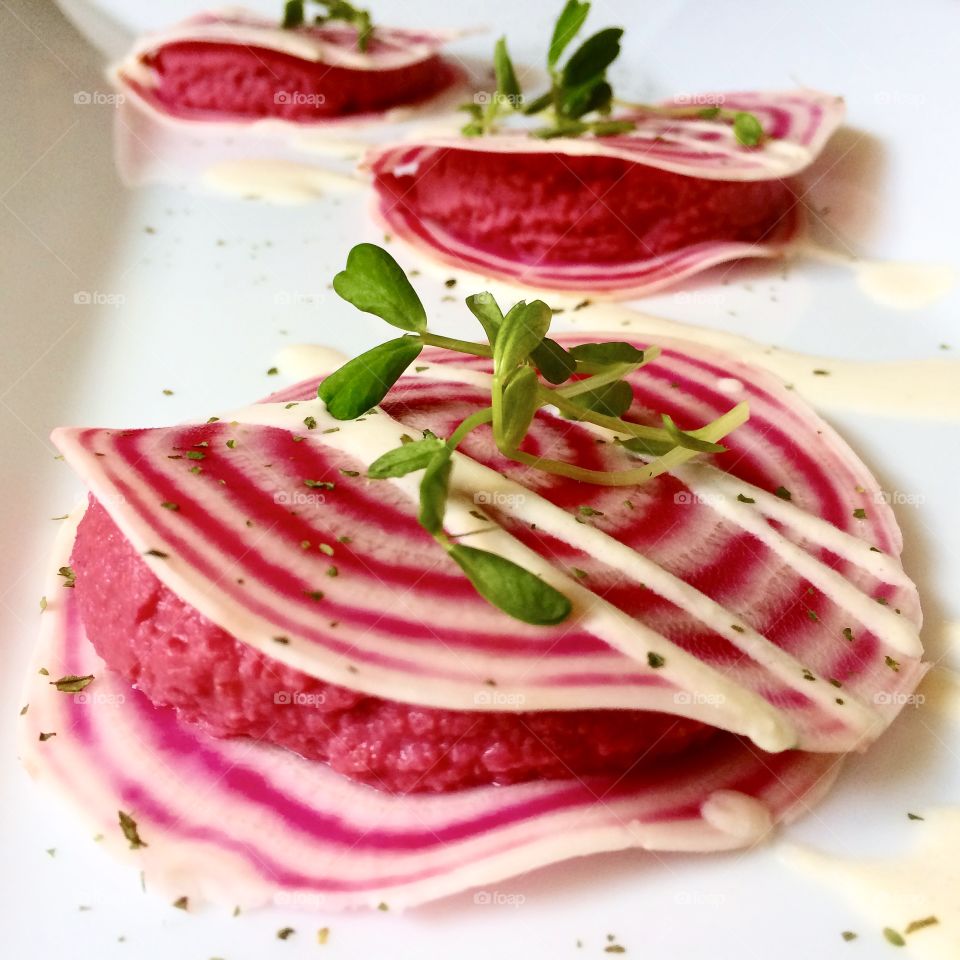 Rainbow beet raviolis with beet root hummus