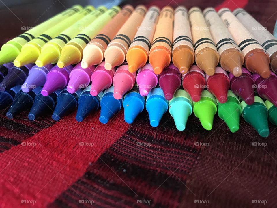 Colourful crayons in a row
