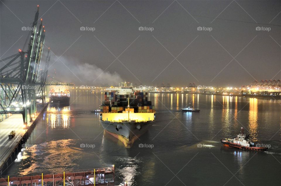 Container vessel is departing from port.