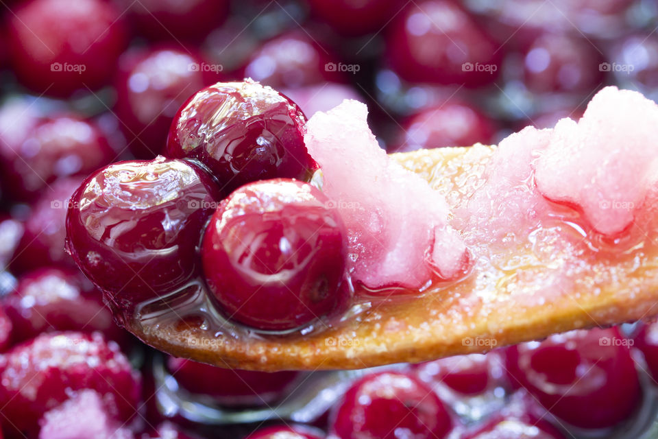 summer is a time of jam cooking! Close up of simmering homemade cherry jam. Cherry and sugar crystal.Cooking Homemade Cherry Jam