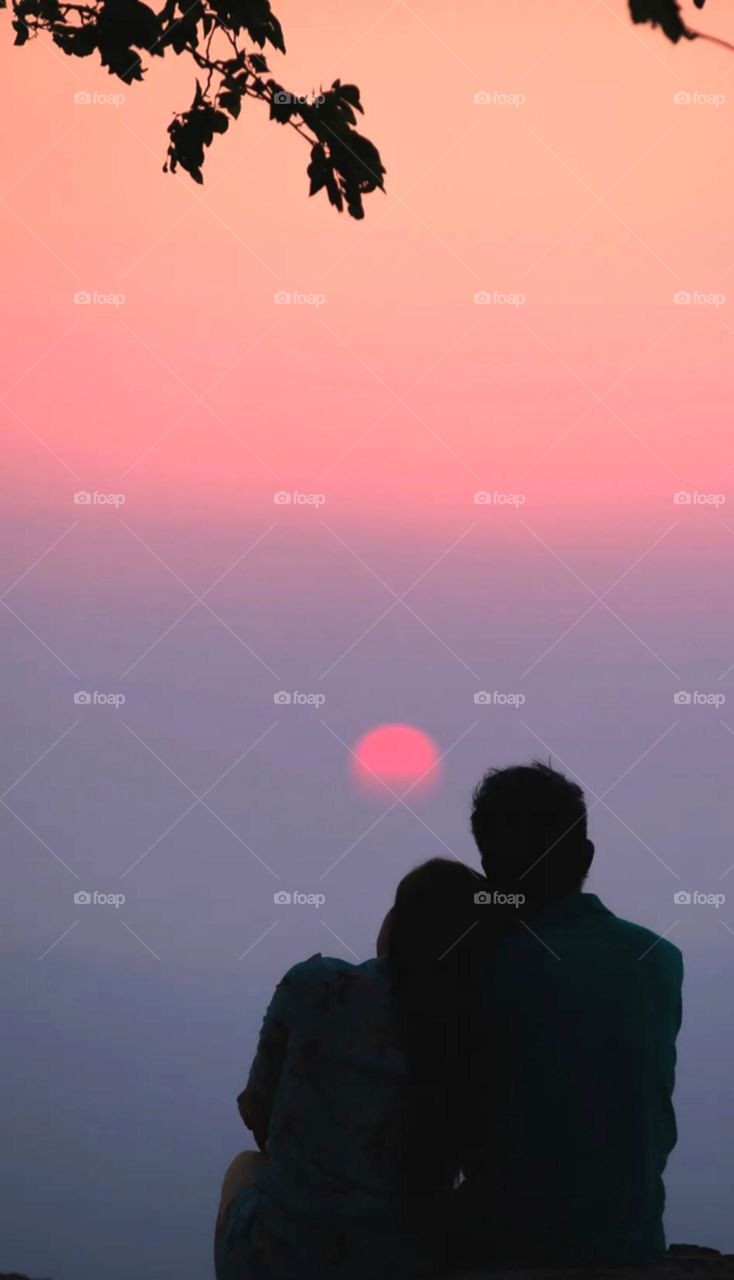 Nice couple spend a time for each other and enjoy a evaning time both and enjoy a sunset great time