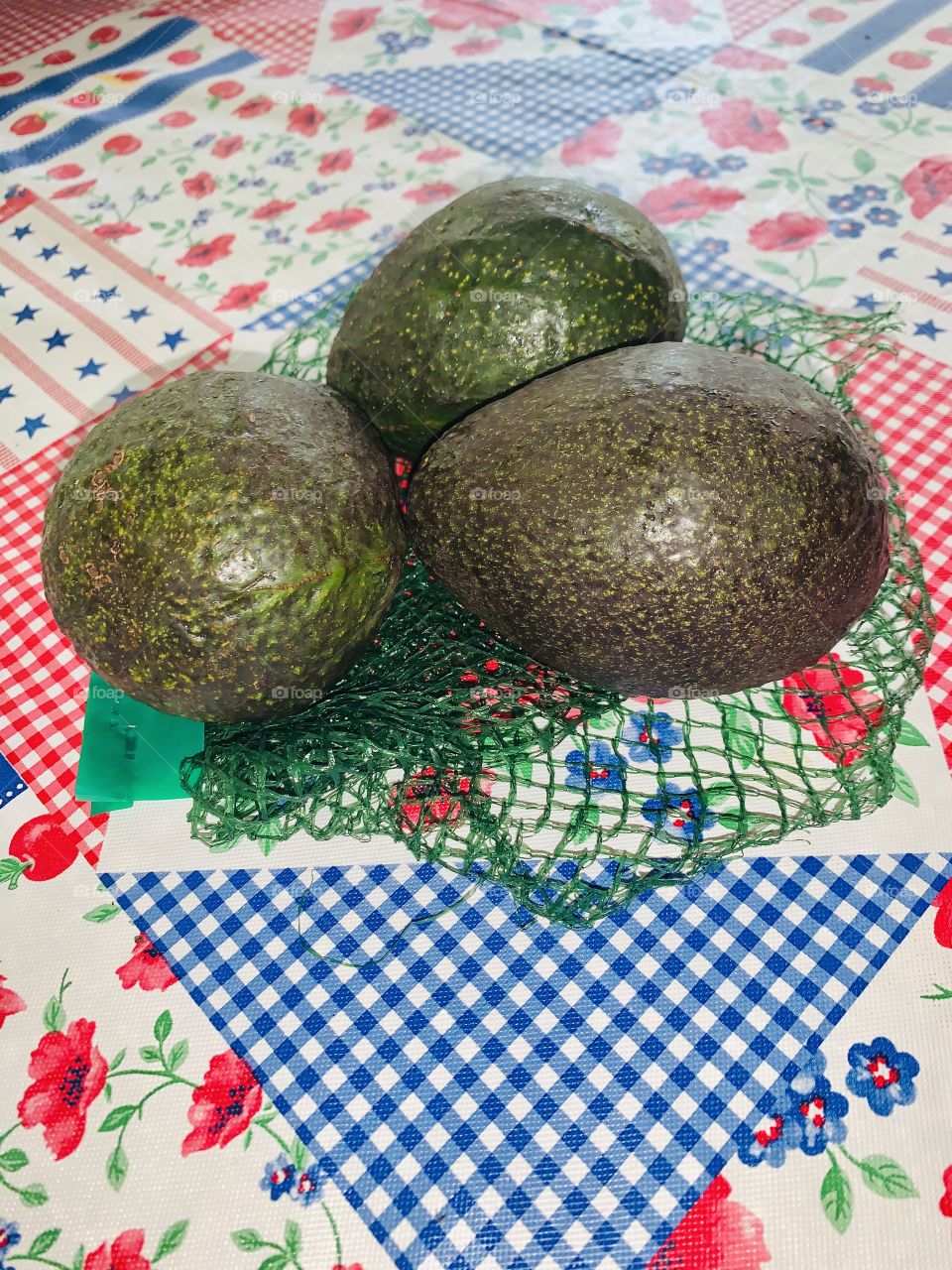 A - Three Avocados - waiting for the to get soft - Avocado fruits have greenish or yellowish flesh with a buttery consistency and a rich, nutty flavor. They are often eaten in salads, and in many parts of the world they are eaten as a dessert.