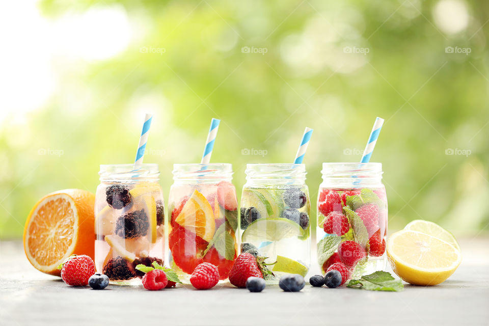 Summer photo. Fresh water with berries