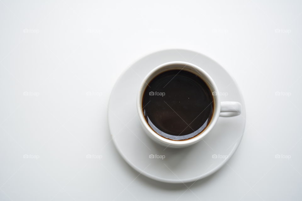 cup of coffee on a white background top view beautiful texture, morning routine