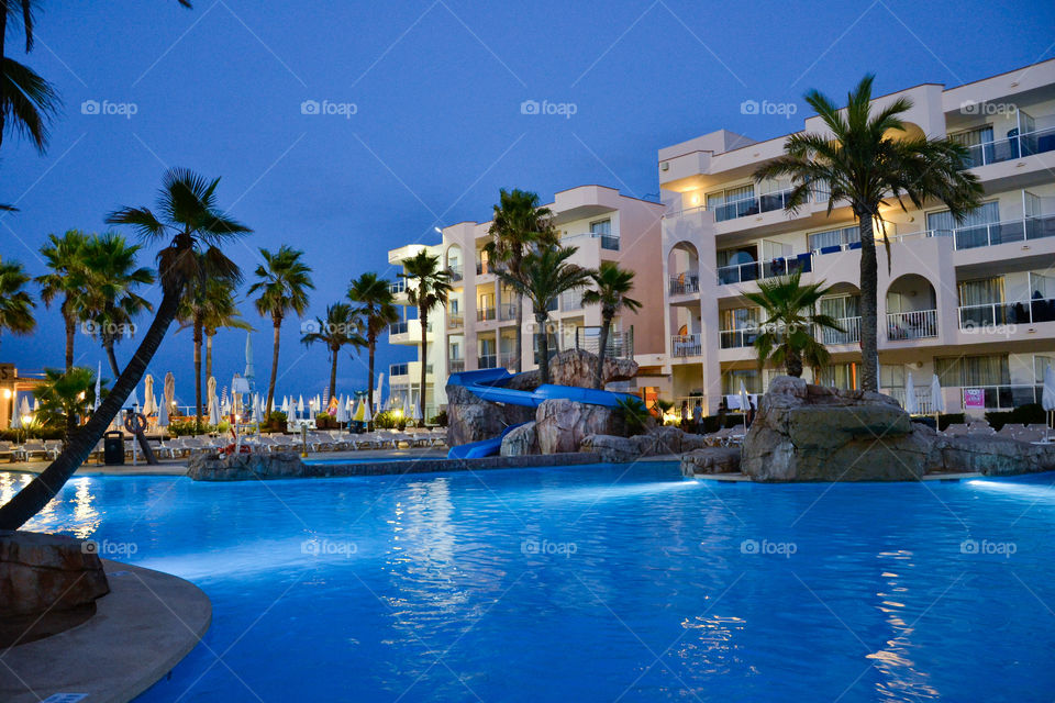 Hotell Alcudia Pins in Alcudia Majorca. View over poolarea at sunset.