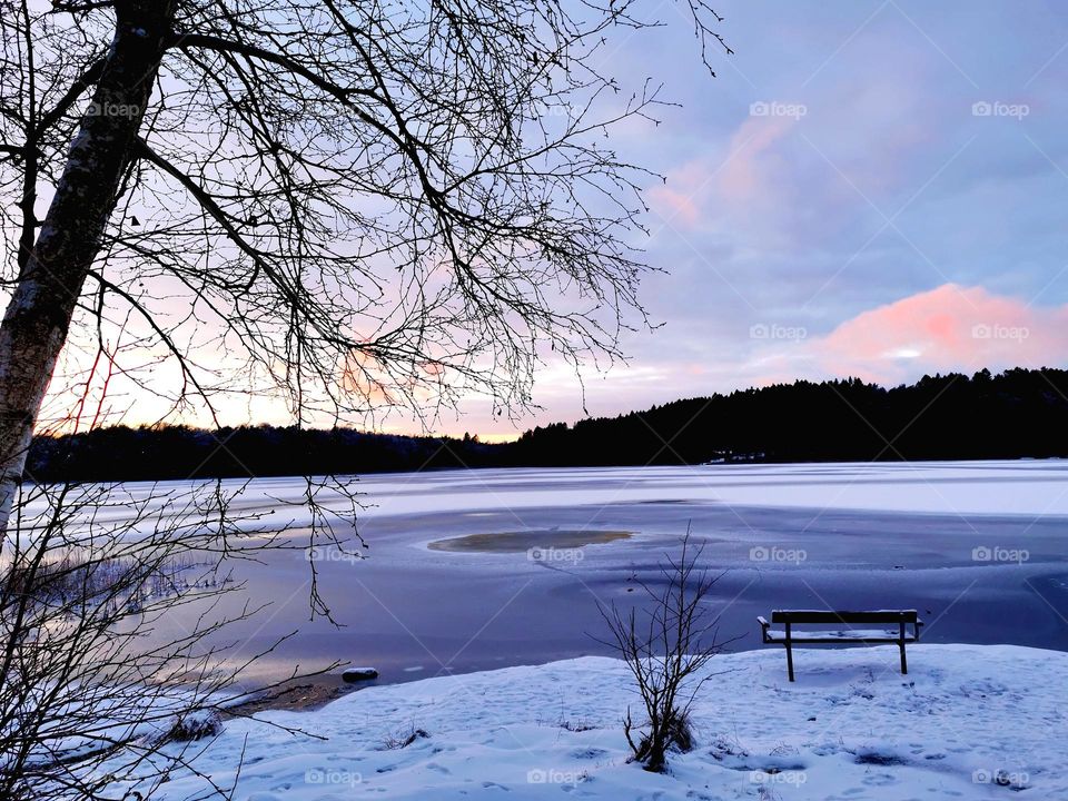 Evening by the lake in winter time