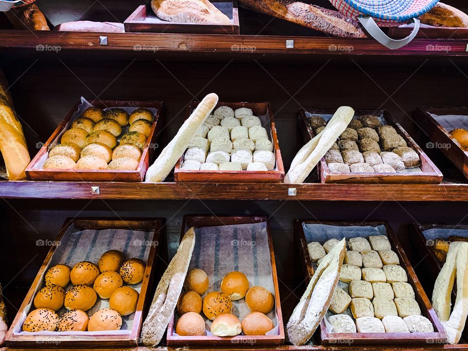 Rectangular wooden boxes with different bread kinds inside