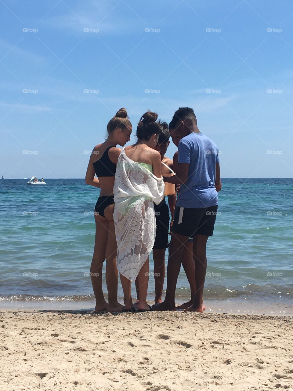 Young people on beach in summertime 