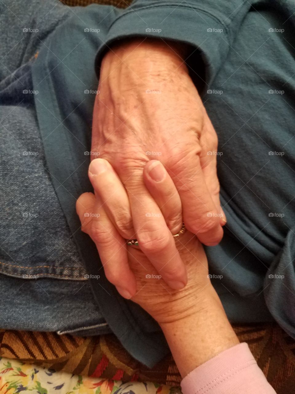 Two people holding hands
