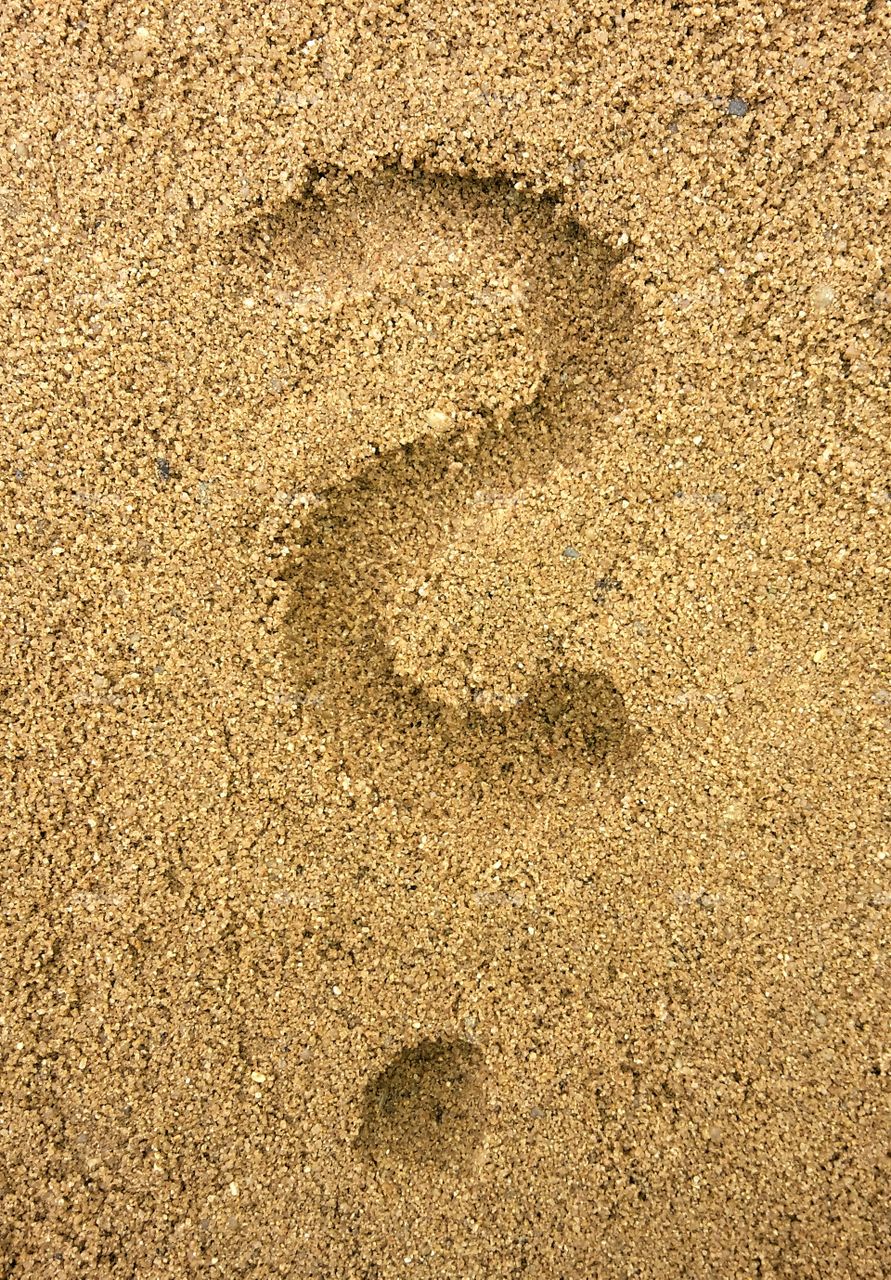 question mark in the sand