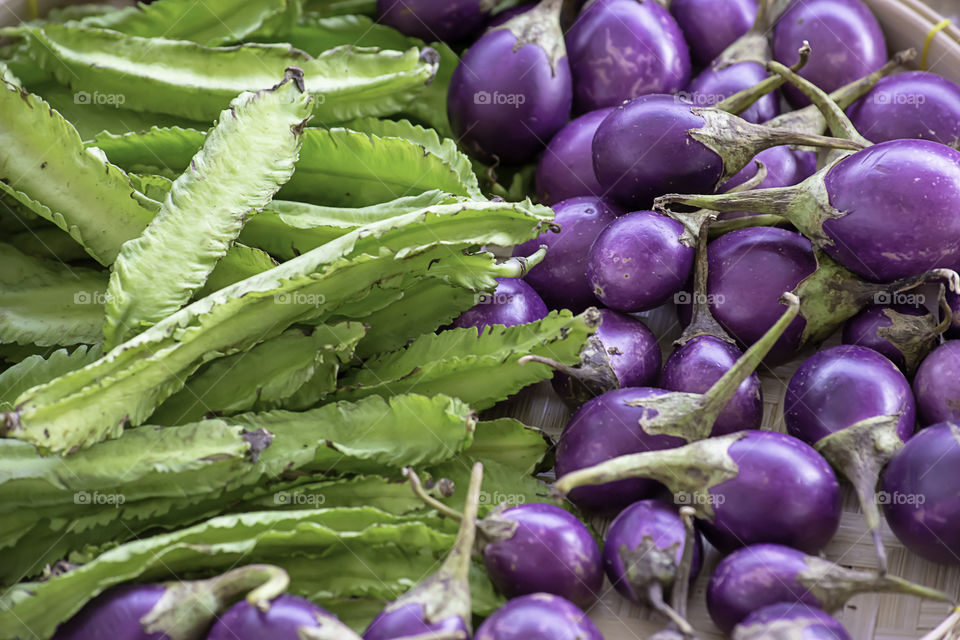 Purple Eggplant and  Winged Bean,Vegetables in bamboo baskets.