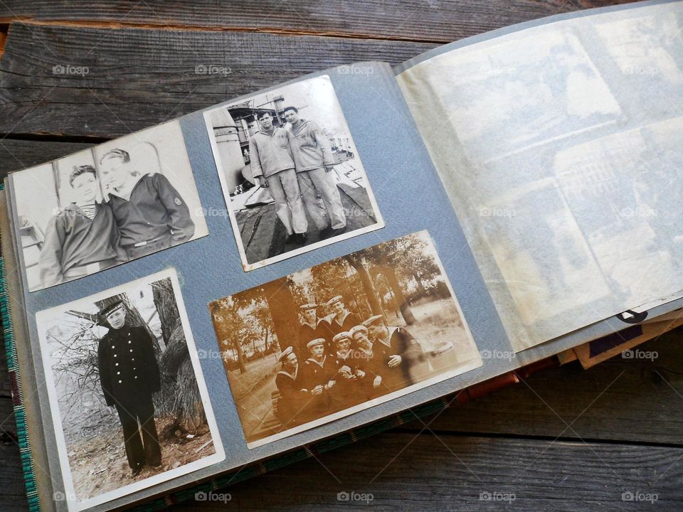 old family album with old black and white photographs