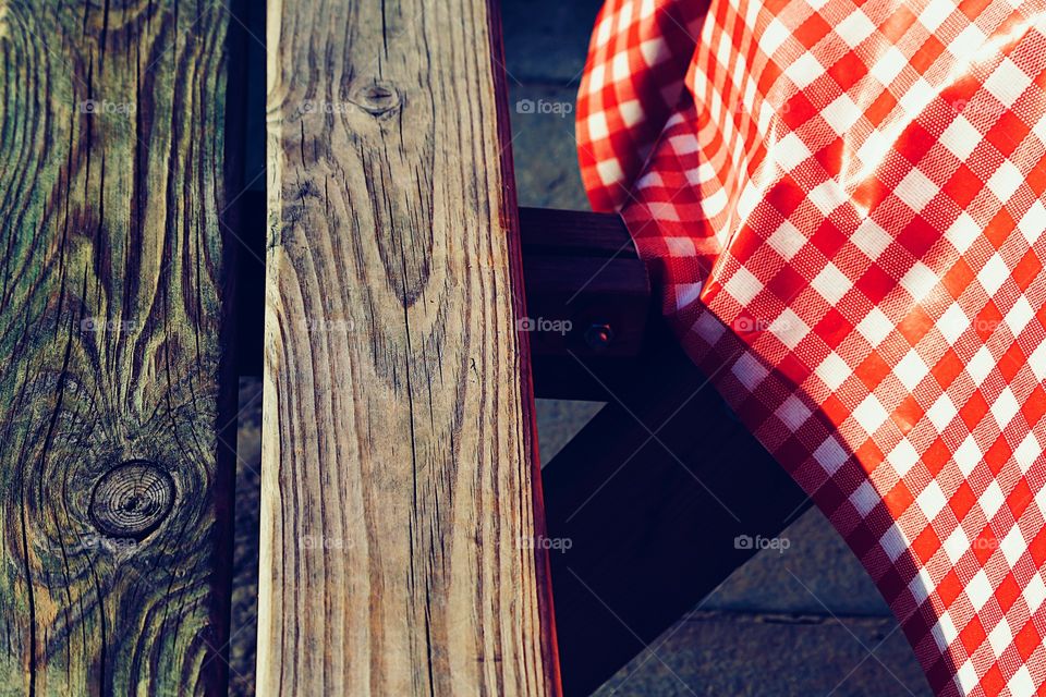 Tablecloth and wooden bench 