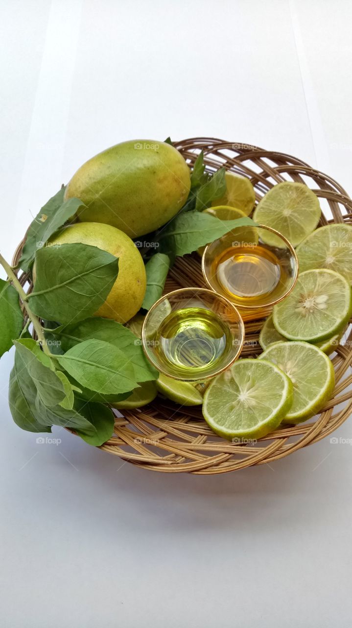 Spa oil with lemon on wicker basket