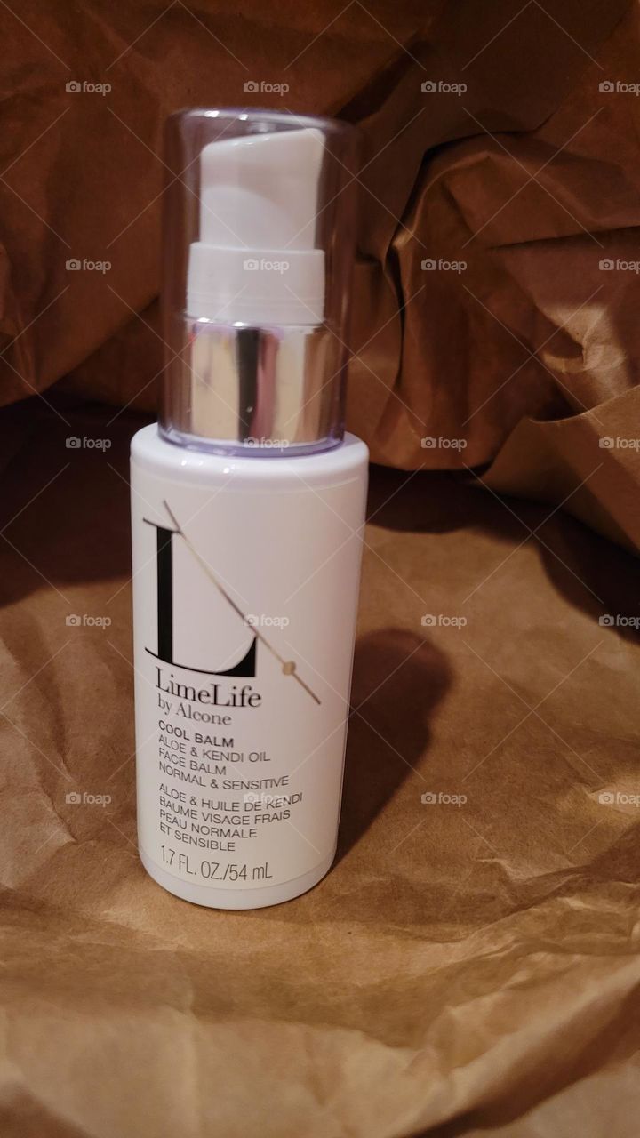 limelife by alcone Cool Balm gel moisturizer with aloe and kendi oil beauty product on neutral background