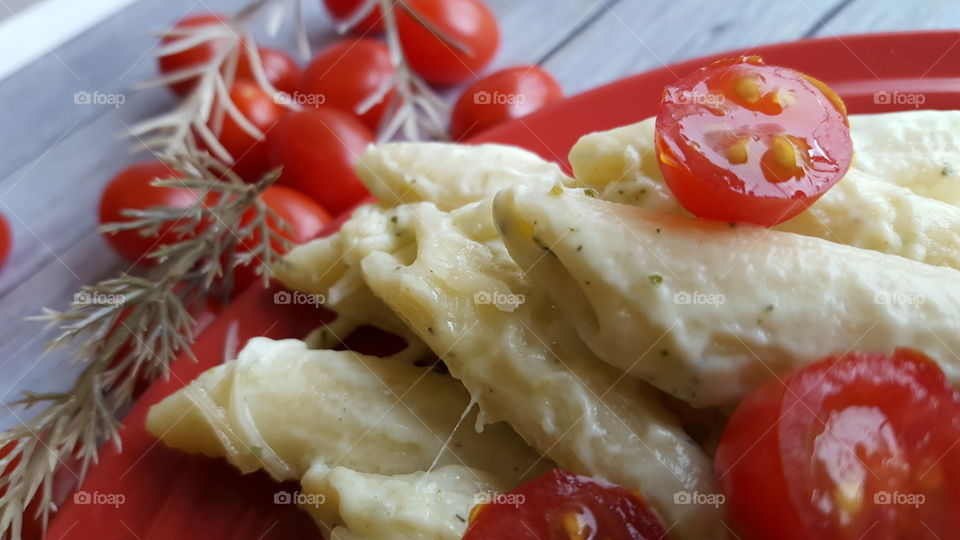 Extreme close-up of pasta with tomatoes