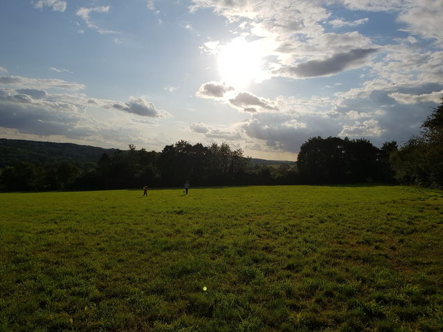 nature walk the sun shines between the clouds