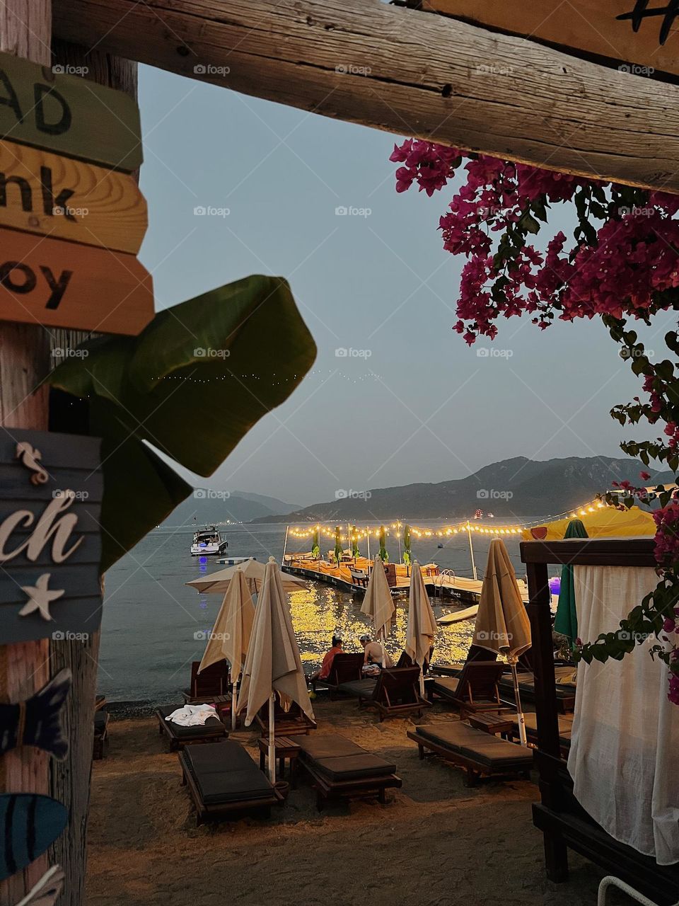 Seaside cafe, terrace by the sea, beach bar, sparkling lights, evening atmosphere, gold lights, summer at the beach, moment of happiness, making memories, summer is a small life
