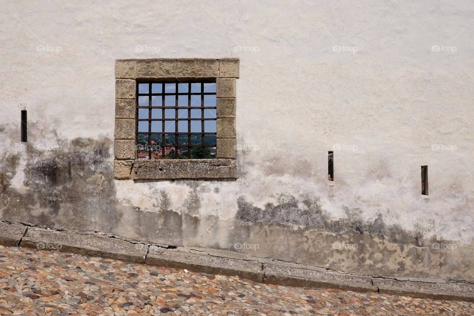 A simple window on a wall.