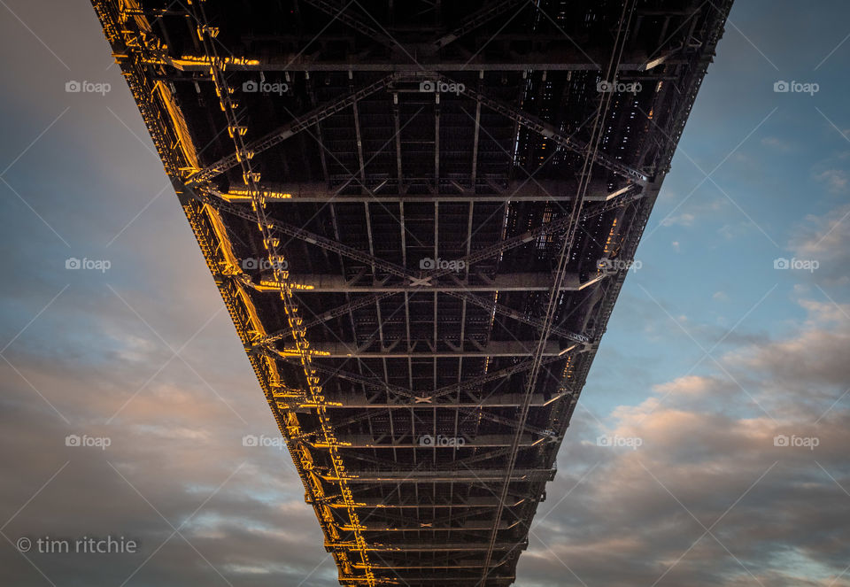The dawn sun playing on the Sydney Harbour Bridge