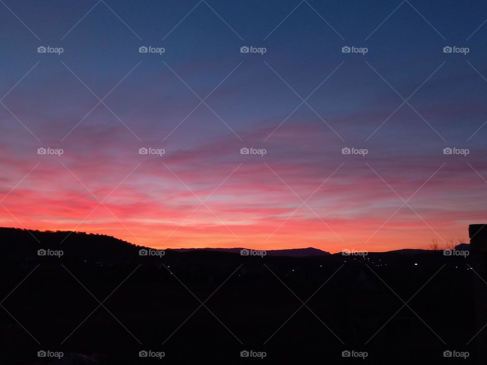 fiery red clouds during sunrise.