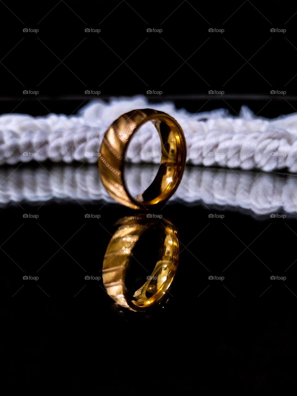 golden ring reflected in the mirror