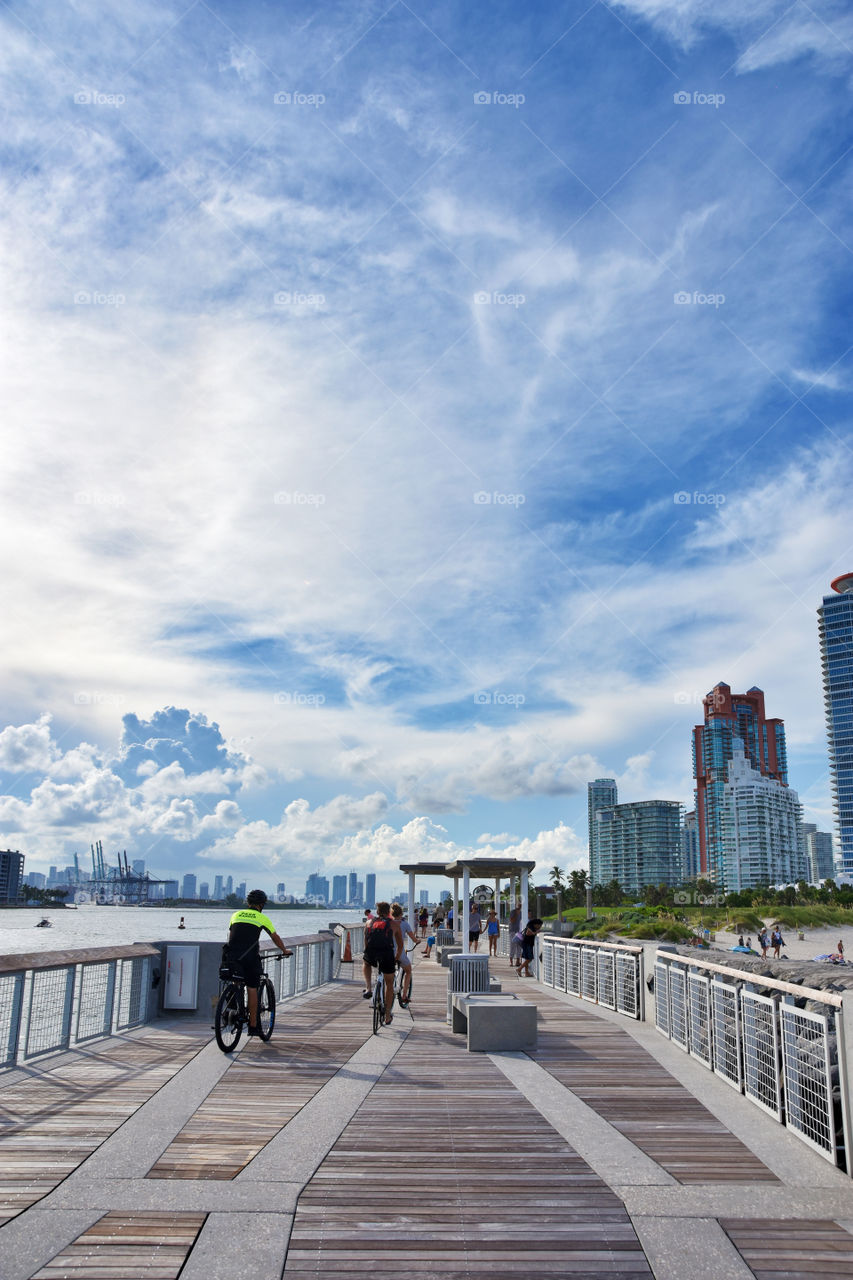 People cycling around Miami city in Florida, Usa during summer day