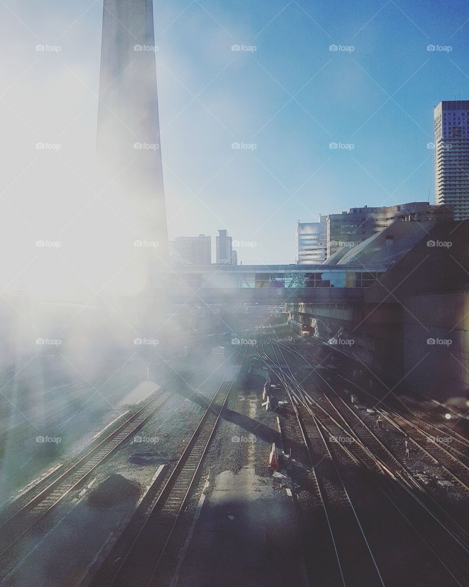 Shot of rail yard and city buildings